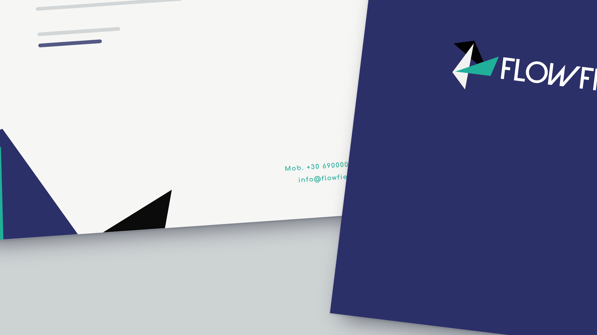 Close-up of the letterhead, the navy folder and the compliments slip