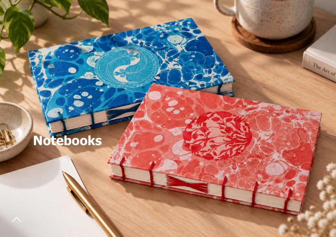 Gift guide page for notebooks: two marbled notebooks, one blue, one red
