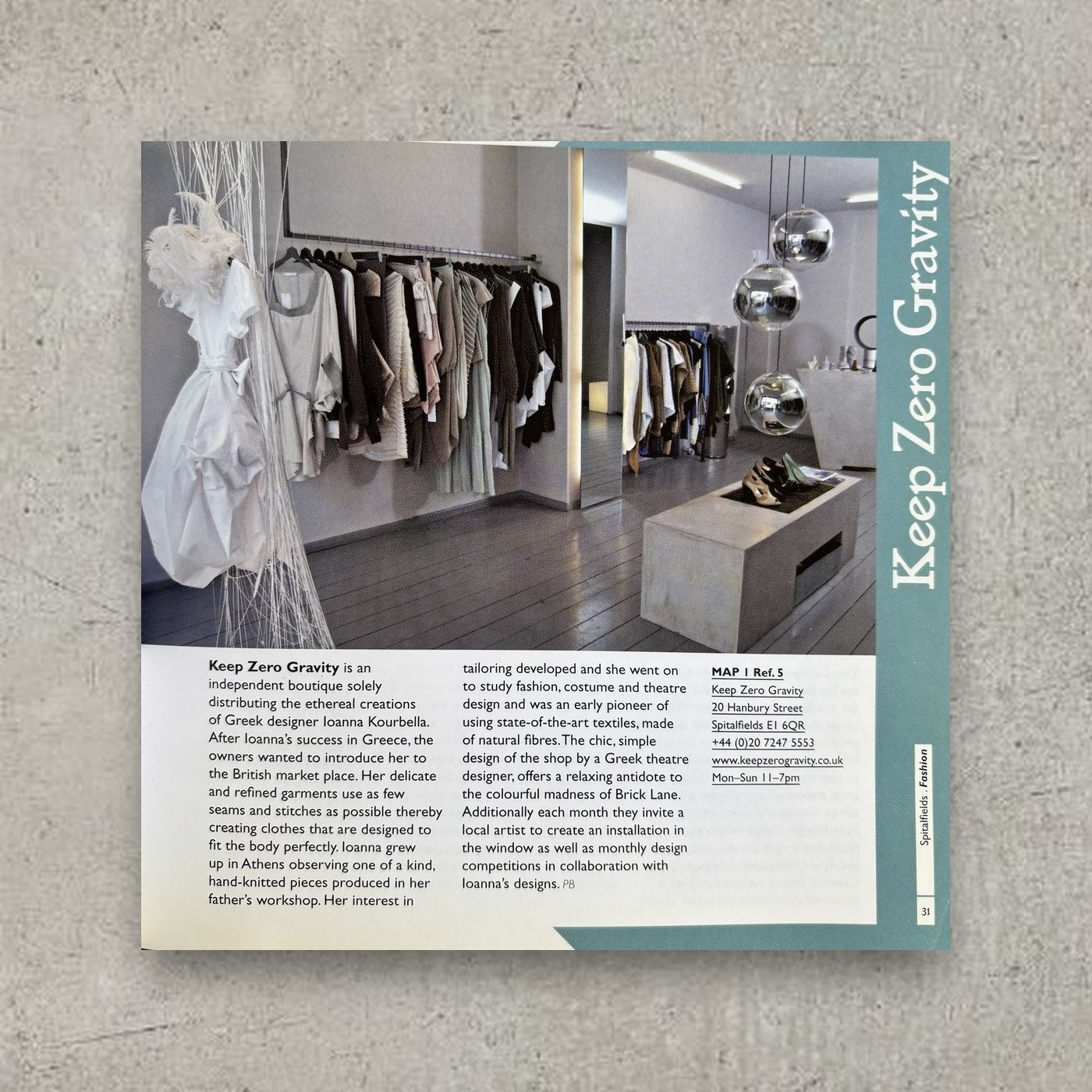 The guide open at the Keep Zero Gravity page, with a photograph of the shop